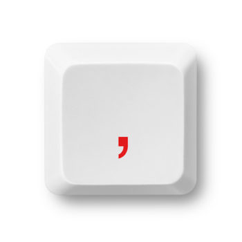 red comma on a white computer key